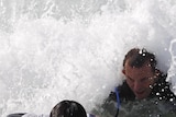 Abbott catches wave with former refugee