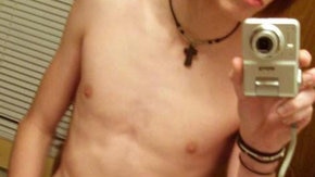 A pic of a very skinny teenage boy taking a photo of himself in the mirror with no shirt on (face cropped out). (blogspot.com)