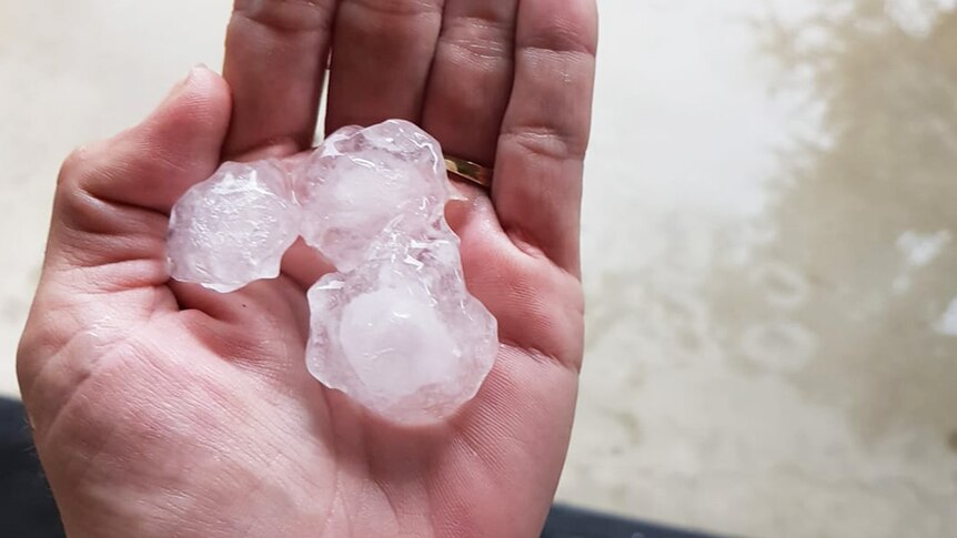 A handful of hail the size of golf balls