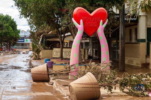 heart sculpture in flooded CBD