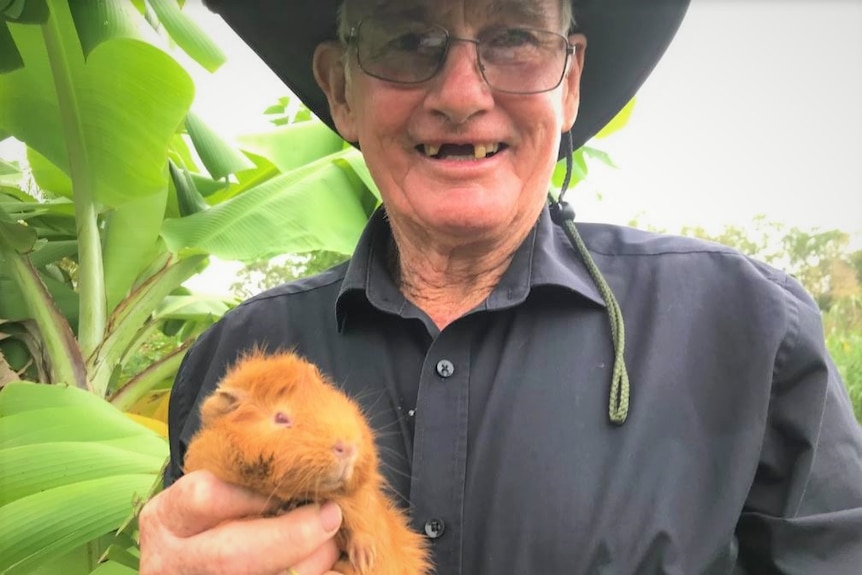 A man holding a guinea pig