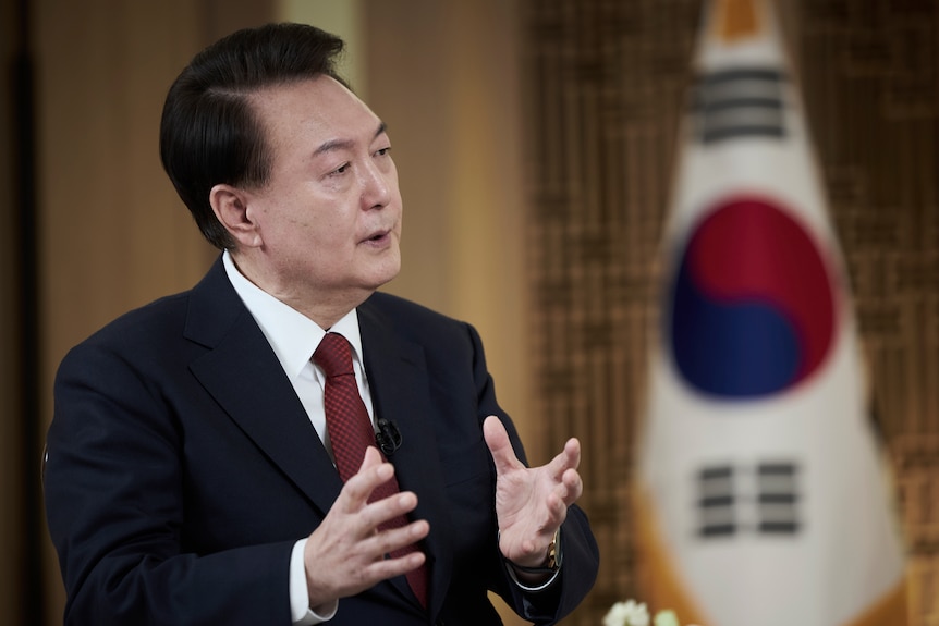 South Korean President Yoon Suk Yeol speaks during a pre-recorded interview with KBS television at the presidential office.