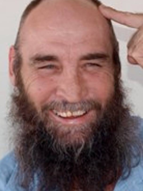 man with bushy beard smiling