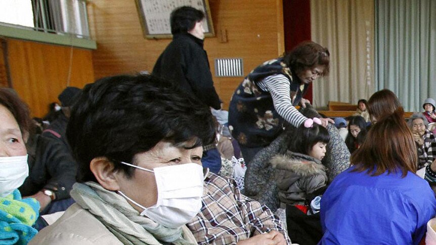 Evacuees from the area of the Fukushima Daiichi nuclear plant take refuge in an evacuation center