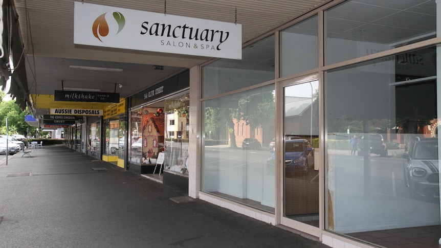 An image of an old spa shopfront in the regional city of Albury, including several neighbouring businesses.