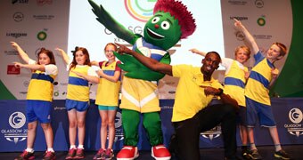 (Custom image) Usian Bolt poses with children in Glasgow