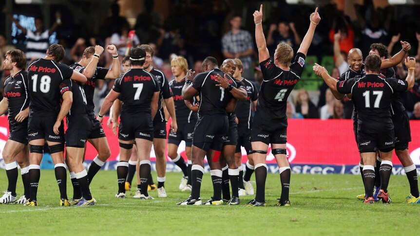 Sharks players celebrate during the team's 21-17 win over the Crusaders in Durban.