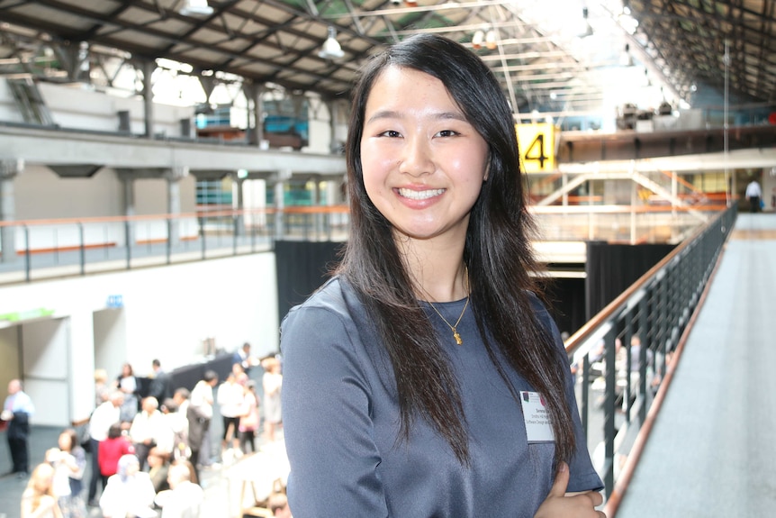 A woman smiling at the camera.