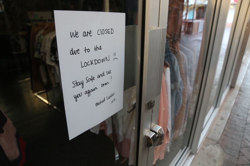 A sign on a door saying: "We are closed due to the lockdown. Stay safe and see you again soon"