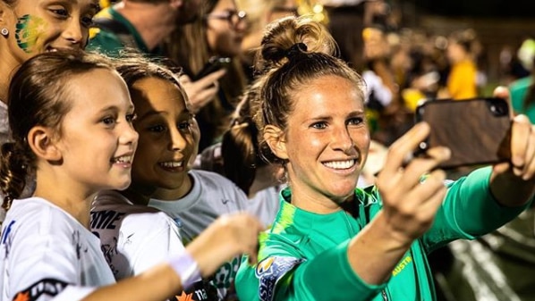 Elilse Kellond-Knight takes a selfie with fans