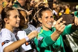 Elilse Kellond-Knight takes a selfie with fans