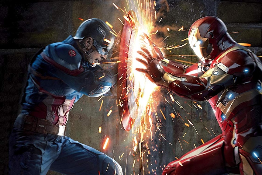 Captain America uses his shield to stop a blast from Iron Man.