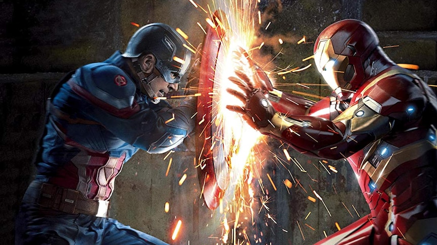 Captain America uses his shield to stop a blast from Iron Man.