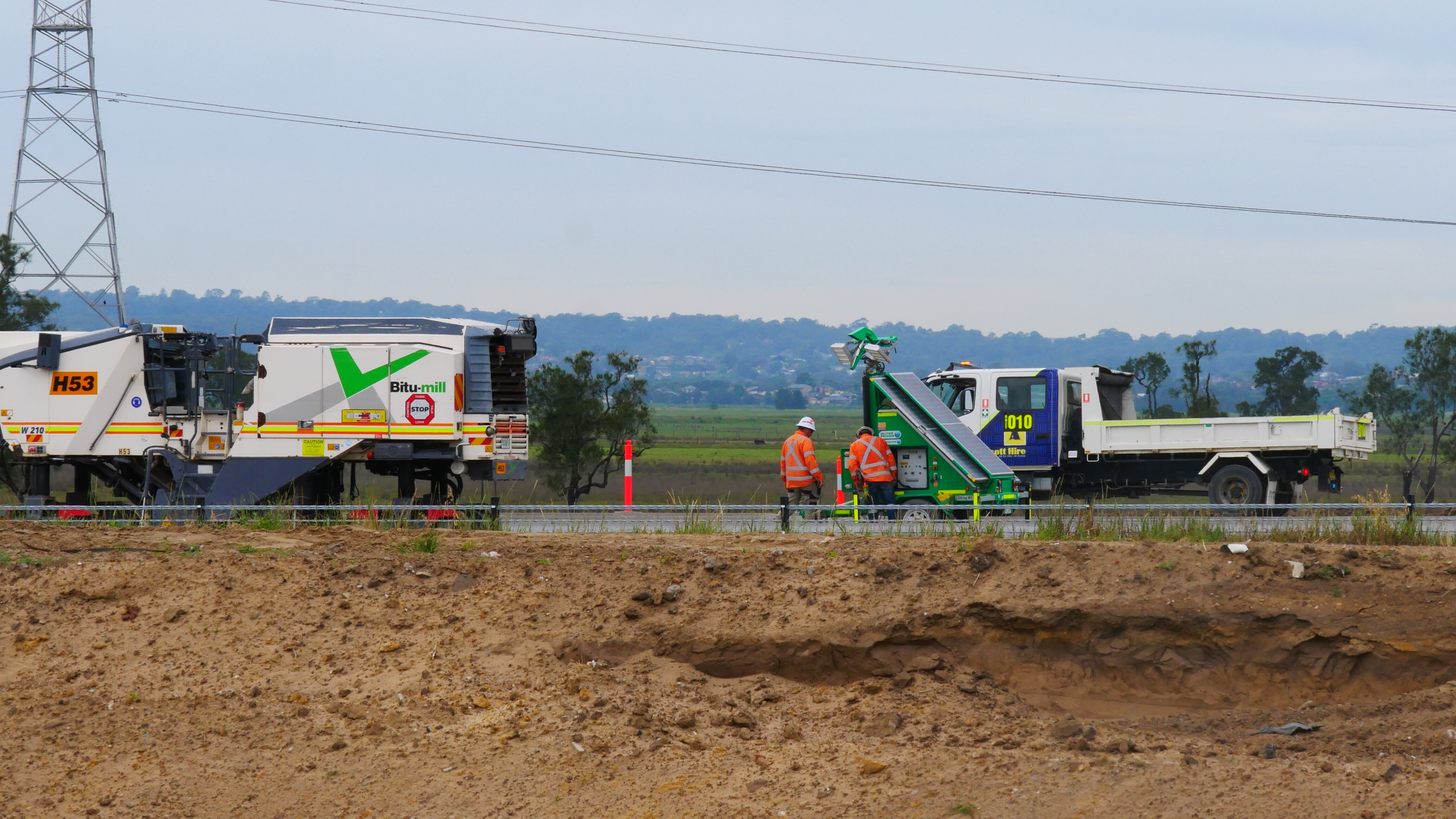 Worker dies after being hit by vehicle at New England Highway ...