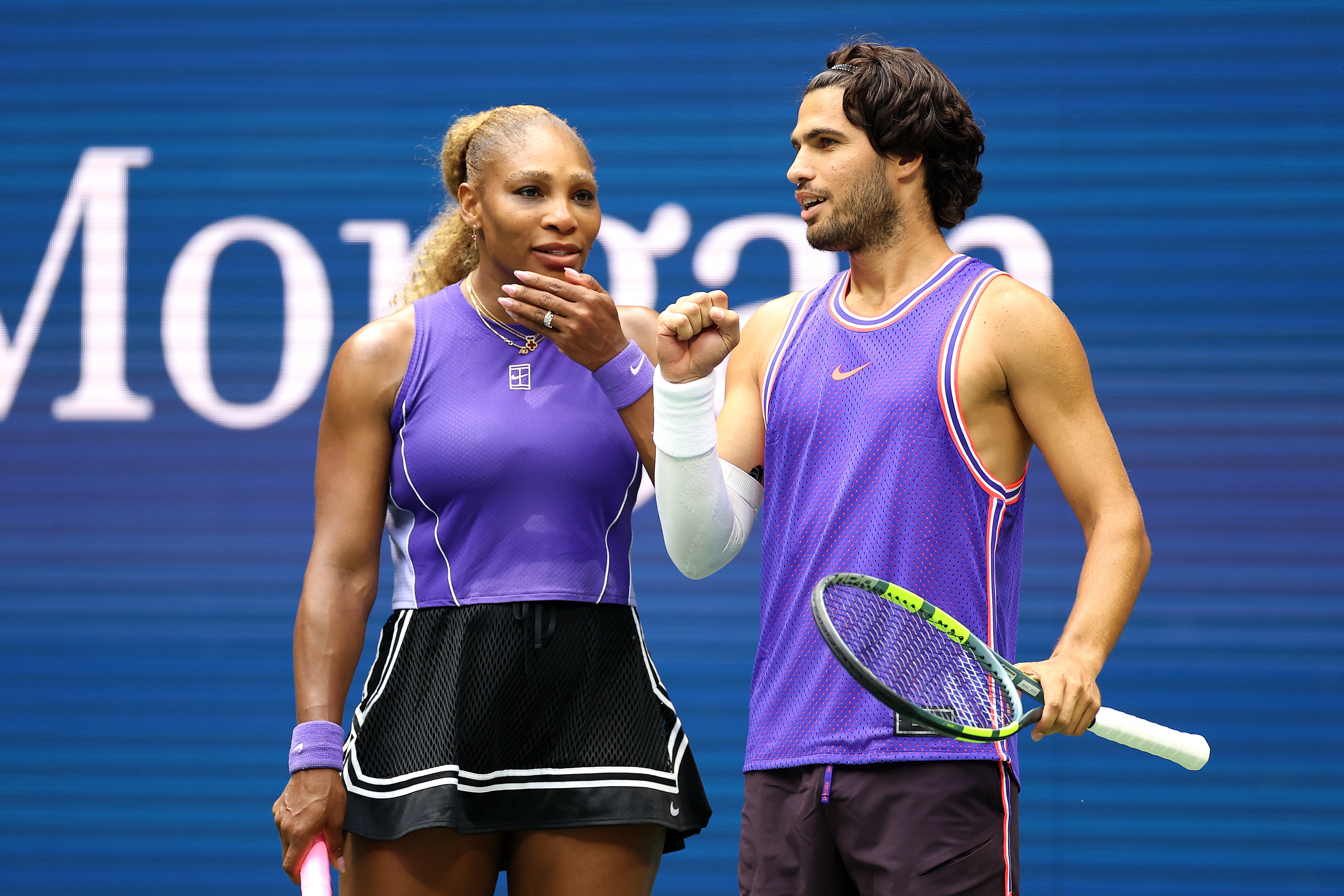 Serena Williams holds her left hand to her face and Carlos Alcaraz pumps his right fist.