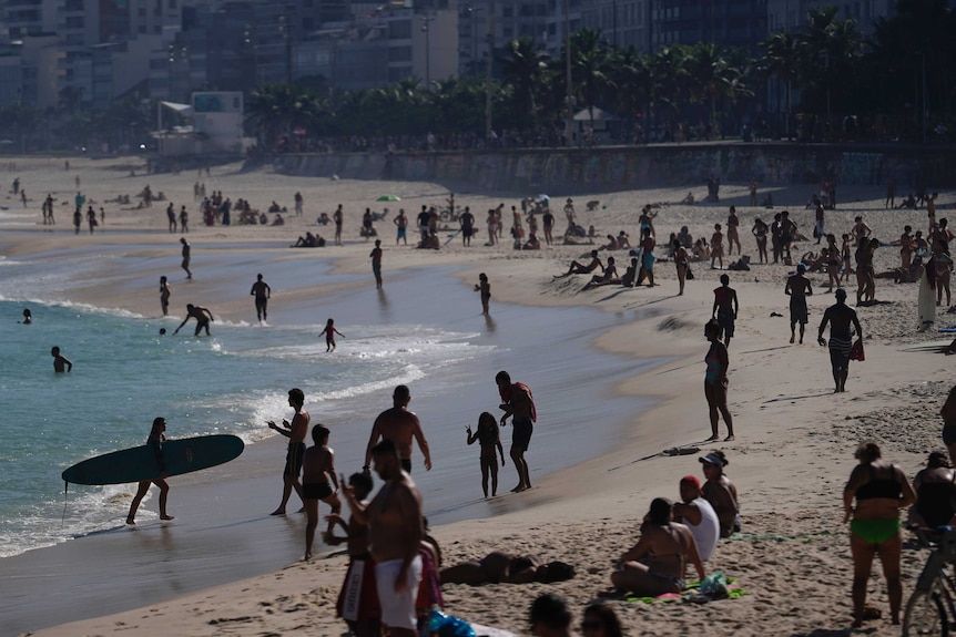 People spend a day in the sun amid the new coronavirus pandemic in Rio.