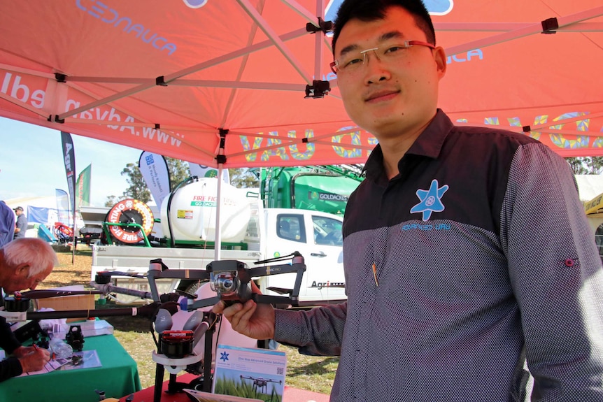 Nathan Liu with drone prototype at Agfest