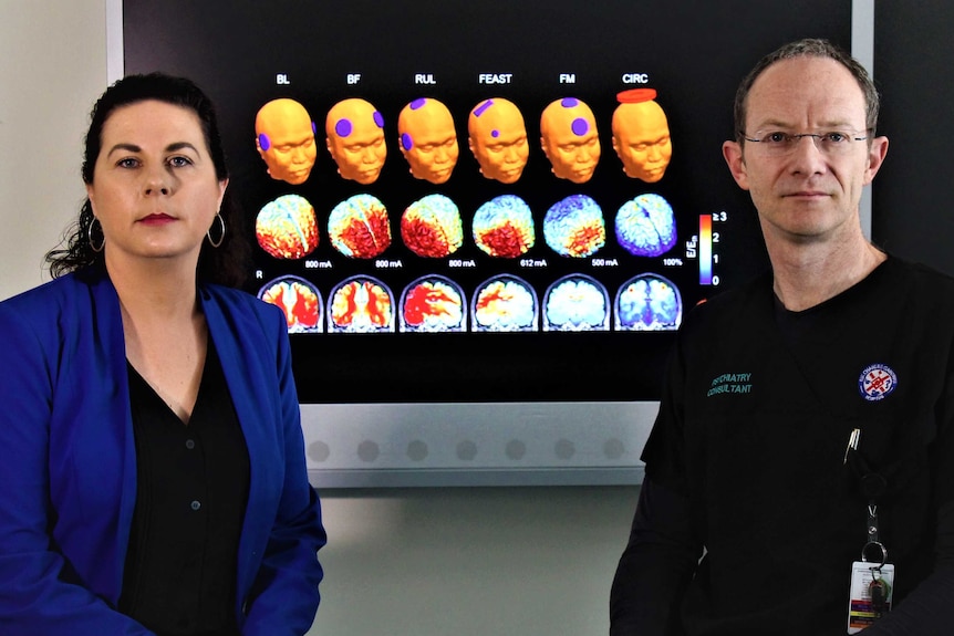 doctors sitting in front of screen with brain scans