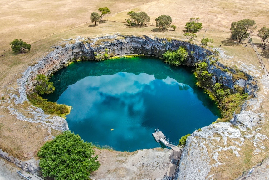 A blue lake among paddocks