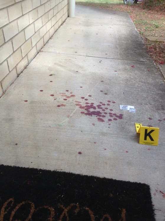 Blood on a neighbour's footpath