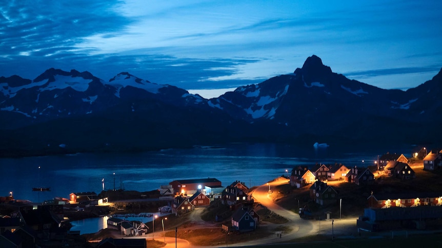 Homes light up a dark neighbourhood at night in Greenland
