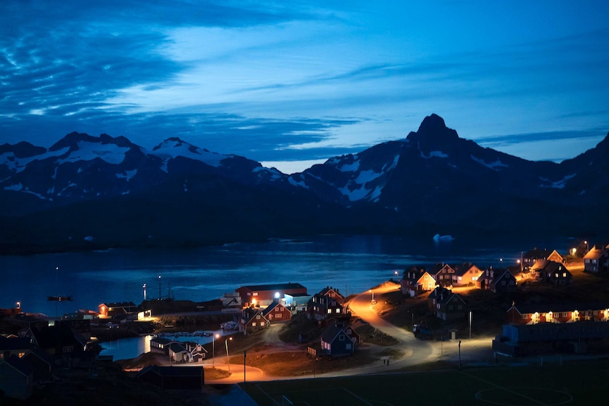Homes light up a dark neighbourhood at night in Greenland