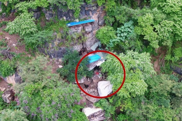 Image provided by Yongshan police shows Song's cave hideout among mountainous jungle.