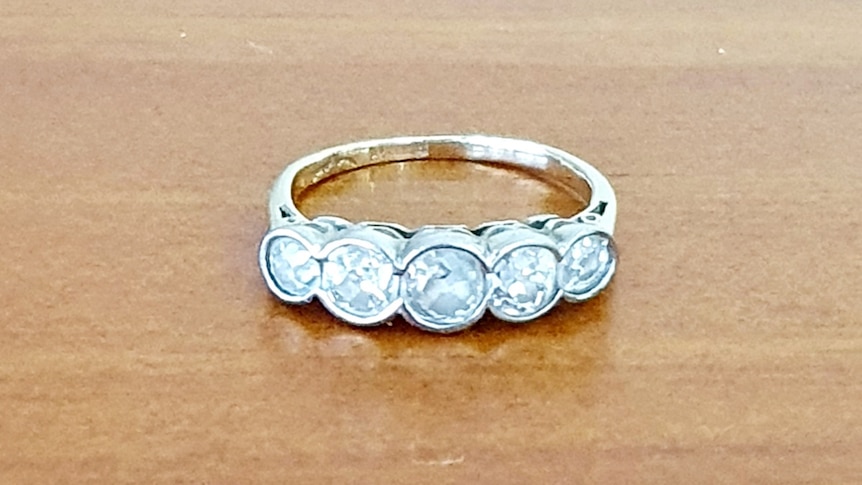 An antique Victorian-era ring containing five diamonds in a row.