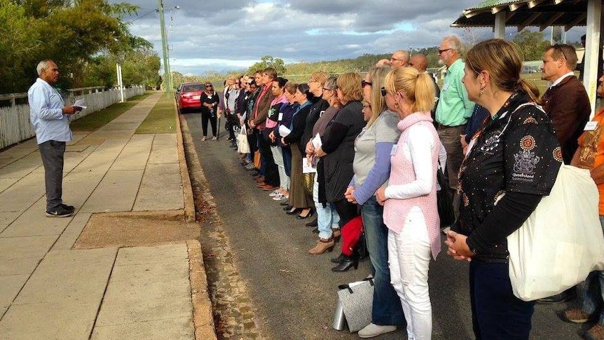 Cherbourg Aboriginal Shire mayor Arnold Murray addresses the principals.