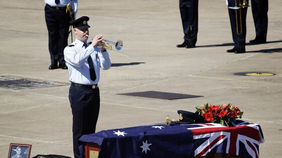 Trumpeter plays as airmen returned home