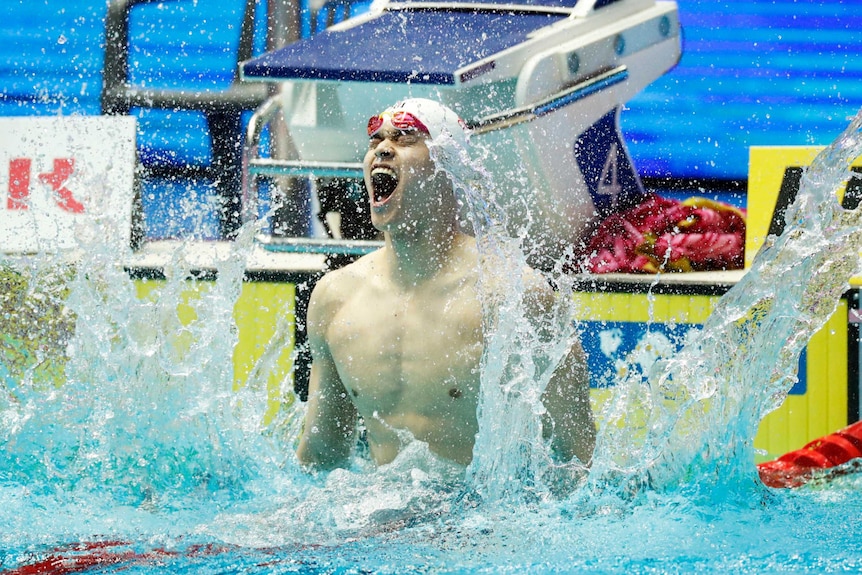 Sun Yang splashes the water with gusto after winning a race at the world championships