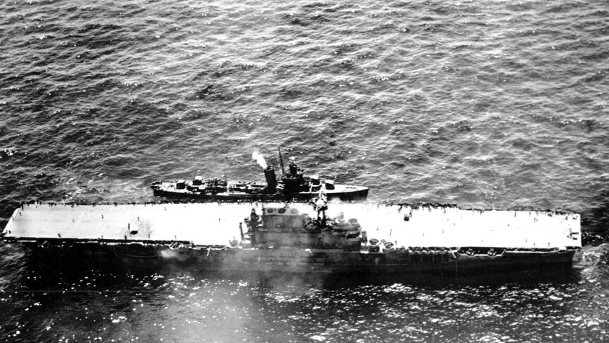 The stricken aircraft carrier USS Hornet lies dead in the waters after a morning attack by Japanese warplanes.