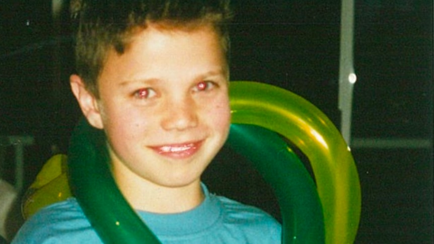 Matt Runnalls, pictured in grade 5, holding balloons.