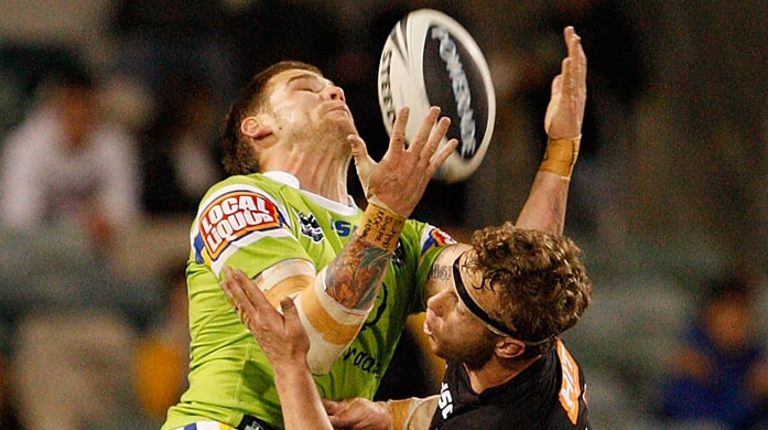 Aerial battle ... Raiders full-back Josh Dugan and Penrith's Nathan Smith go for a high ball.