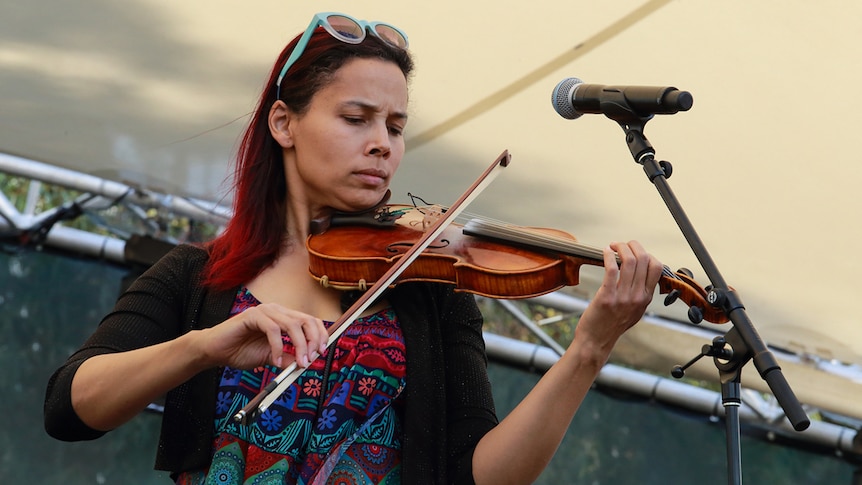 Rhiannon Giddens plays the fiddle live on stage at WOMADelaide 2020