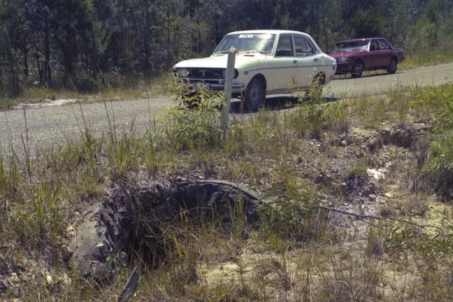 A car by a road.