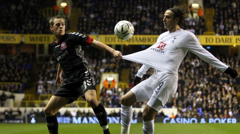 Winning Spurs ... Thomas Enevoldsen of Aalborg (l) and Dimitar Berbatov of Tottenham battle for the ball