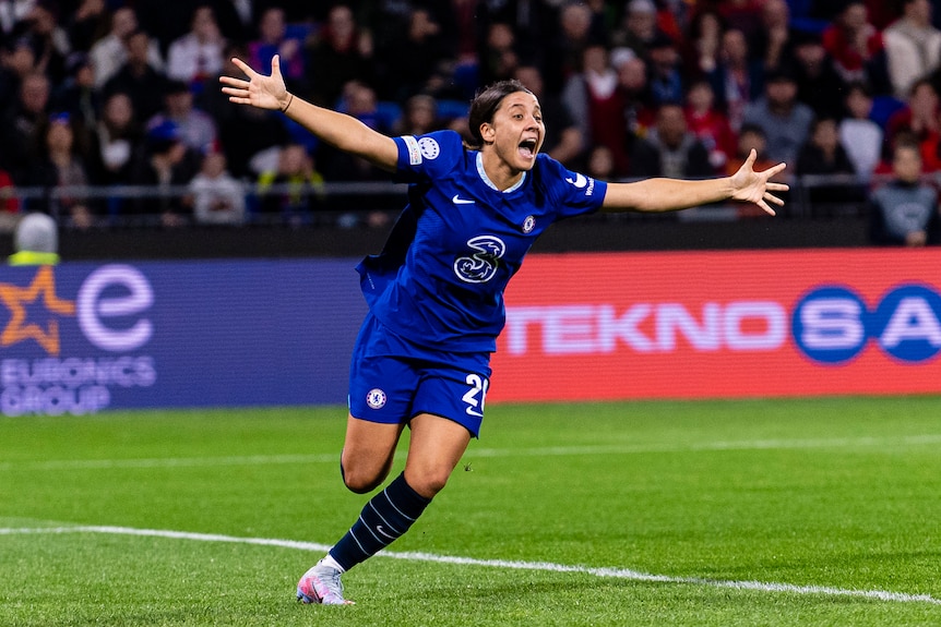 Sam Kerr runs and smiles and shouts with her arms outstretched after a Chelsea goal against Lyon in the Champions League.