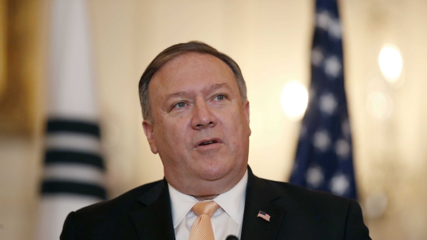 An upper body shot of Mike Pompeo wearing a suit