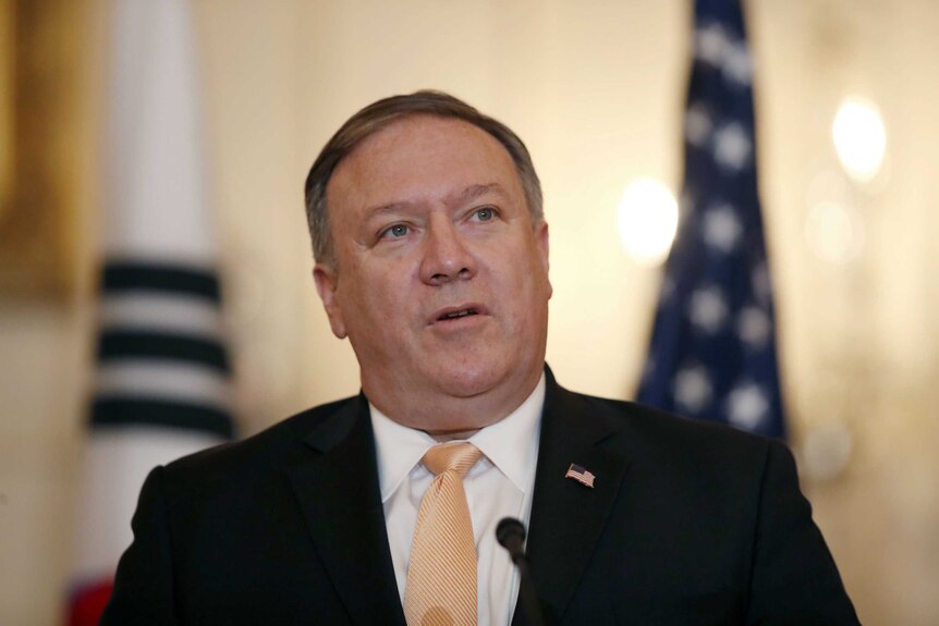 An upper body shot of Mike Pompeo wearing a suit