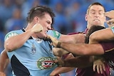 NSW's Paul Gallen punches Queensland's Nate Myles in Origin I.