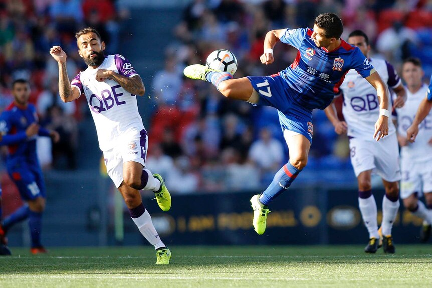 Daniel Georgievski tries to backheel the ball in the air during a contest with Diego Castro.