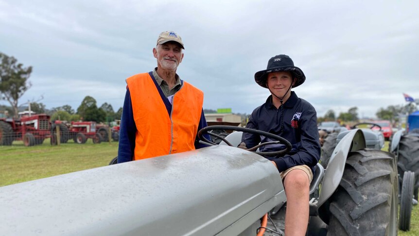 Gerard Gelston with his grandson Thomas, who is sitting a top an old Ferguson tractor.