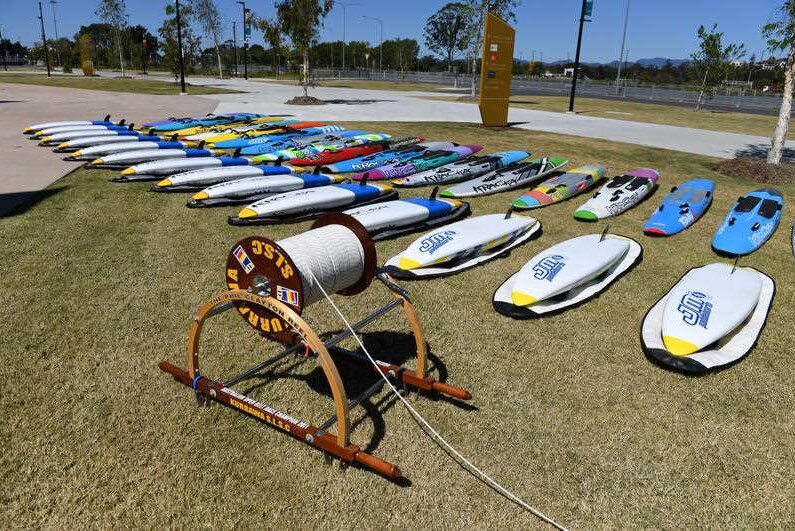 A vintage surf reel and surf boards were displayed at the entrance to the memorial service.