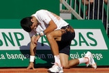 Serbia's Novak Djokovic falls during a quarter-final against David Goffin in Monte Carlo.