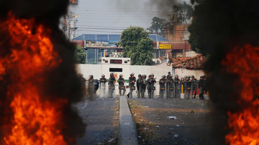 Venezuelan protesters clash with soldiers and Government supporters at the border with Colombia