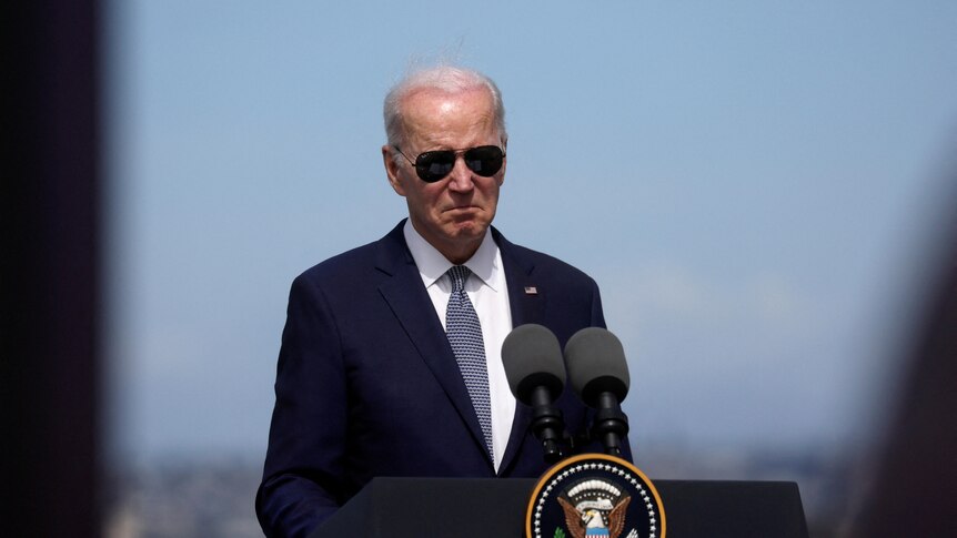 Joe Biden wears his aviator sunglasses.