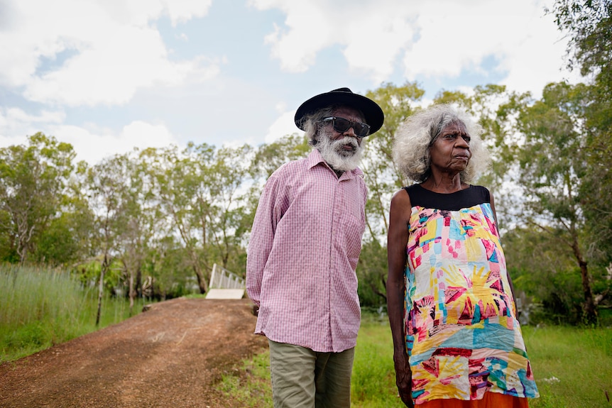 an elderly aboriginal couple in the bush