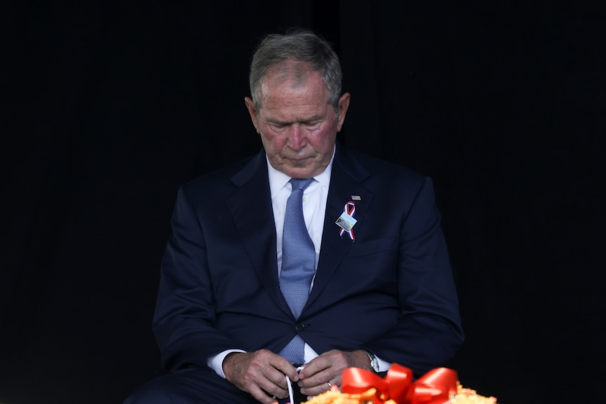 George W Bush looking sombre.