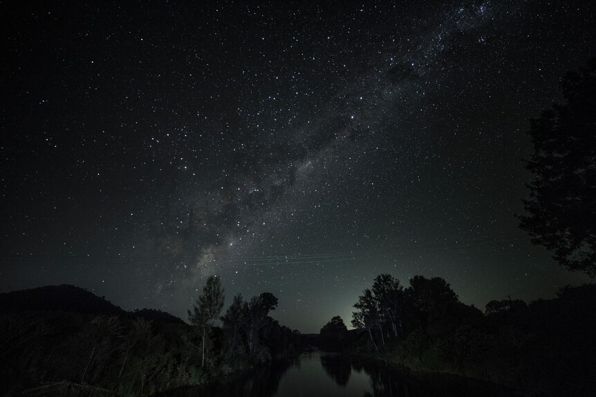Millions of stars shine in a dark sky over the Sunshine Coast HInterland.